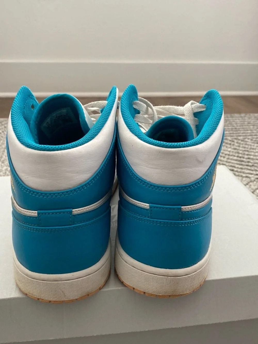 Jordan Air Jordan 1 Mid White and Teal Basketball Sneakers